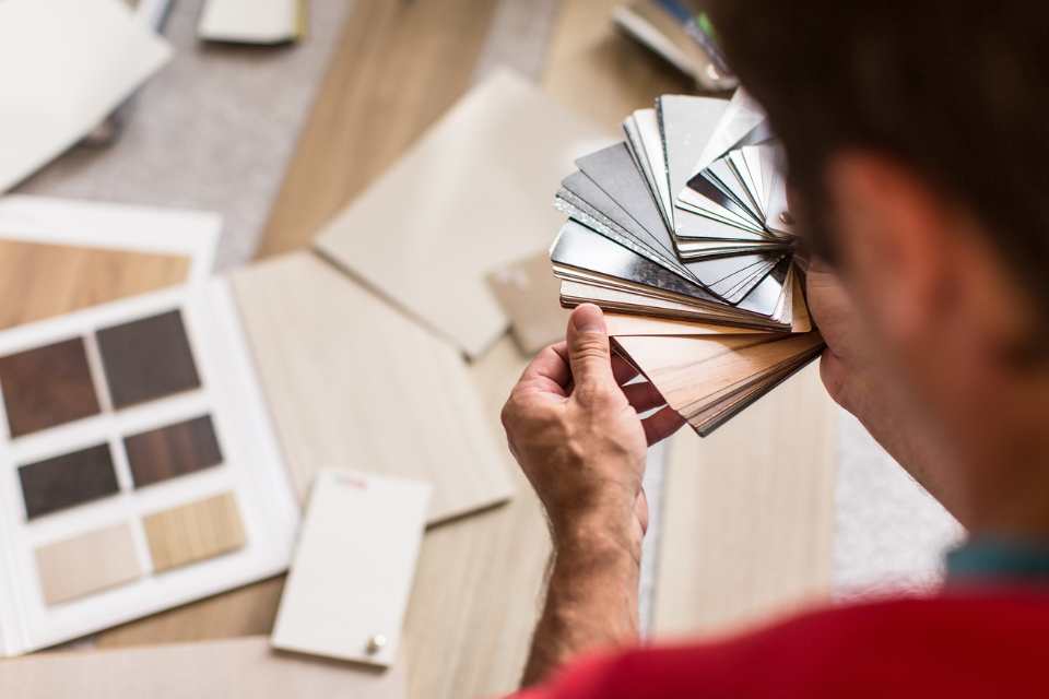 comparing laminate and vinyl samples for new project